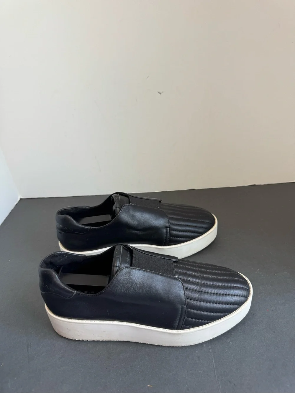 Donna Karan New York black leather slip-on sneakers. Size 6